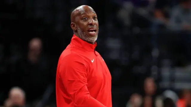 Chauncey Billups seen wearing a red Nike sweater