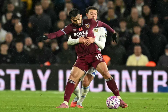 Ethan Ampadu (back) grapples with West Ham United's Brazilian midfielder Lucas Paqueta