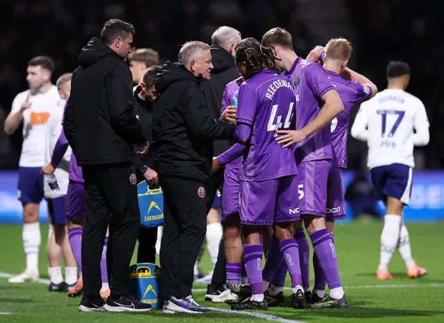 Chris Wilder, Manager of Sheffield United, talks to his team