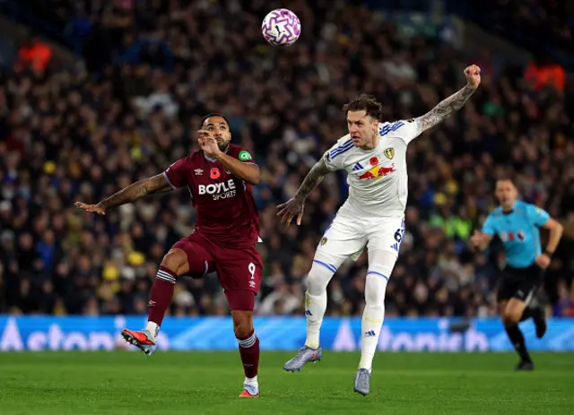 Callum Wilson of West Ham United is challenged by Joe Rodon