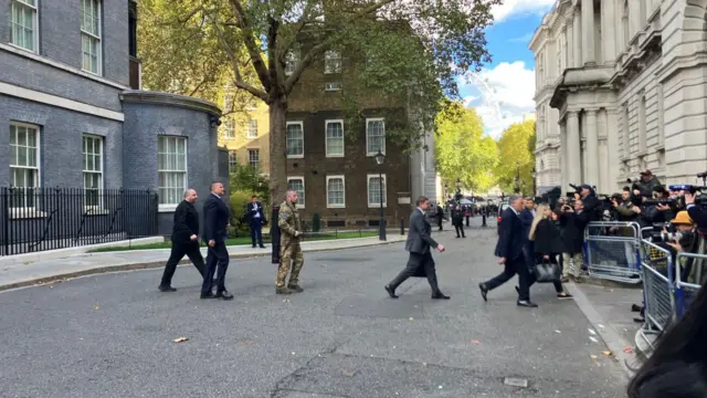 Ukrainian delegation walks towards FCDO