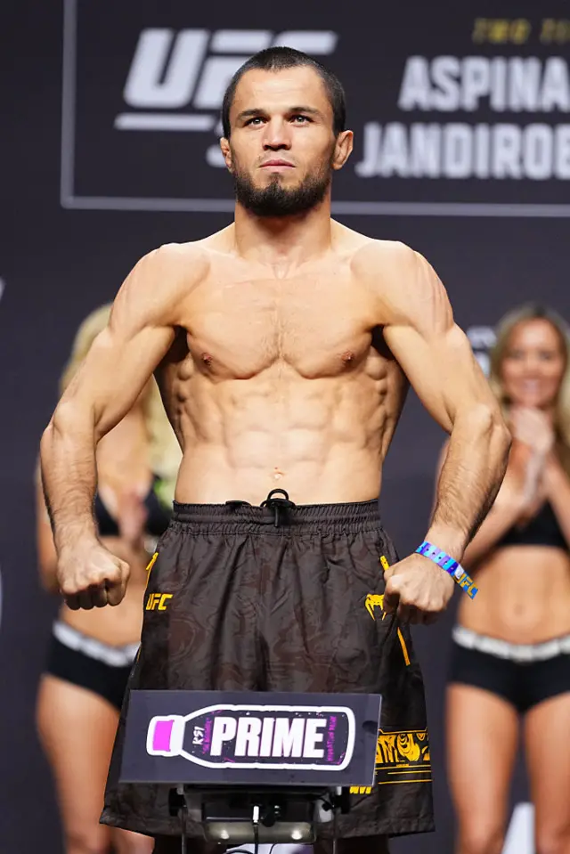 Umar Nurmagomedov flexes he weighs in for a UFC fight