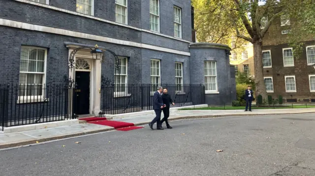 Zelensky and Starmer walk together outside Downing Street