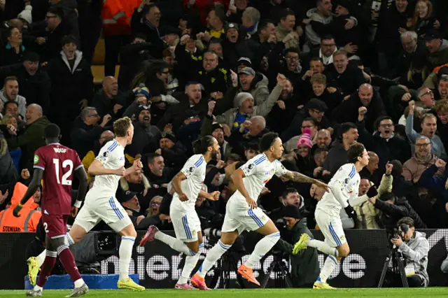 Brenden Aaronson (R) celebrates