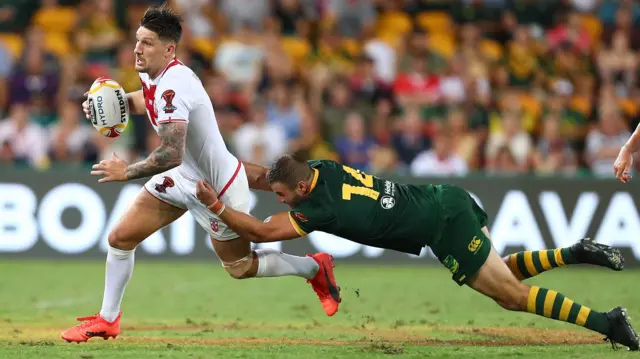 Garth Widdop of England is tackled by Wade Graham of Australia during the 2017 Rugby League World Cup Final