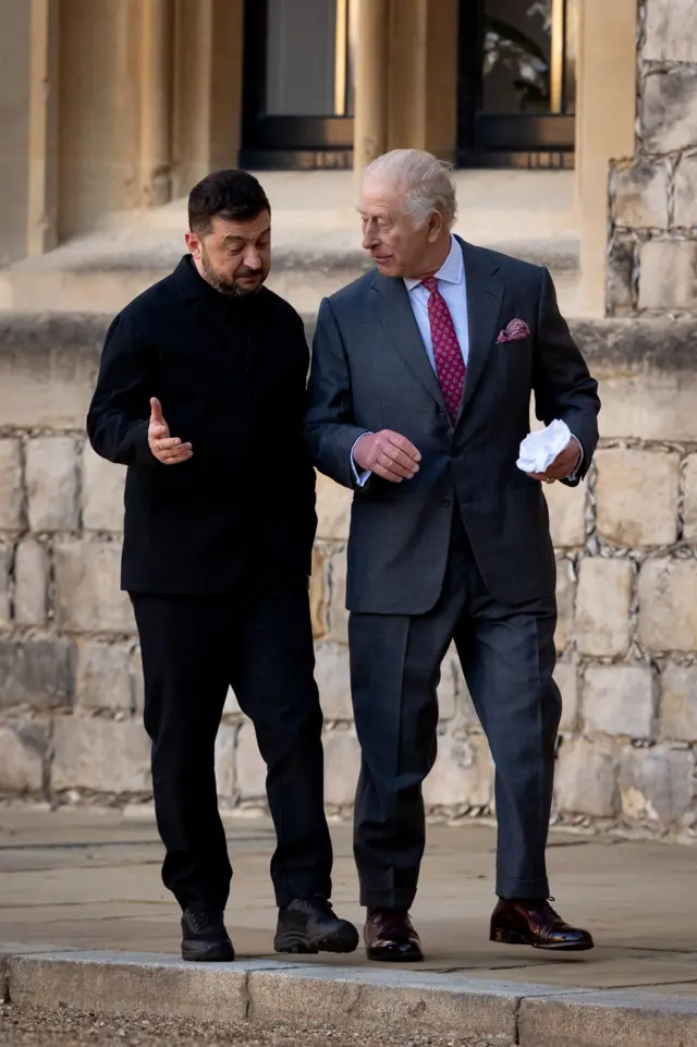 Zelensky and the King talk and gesture