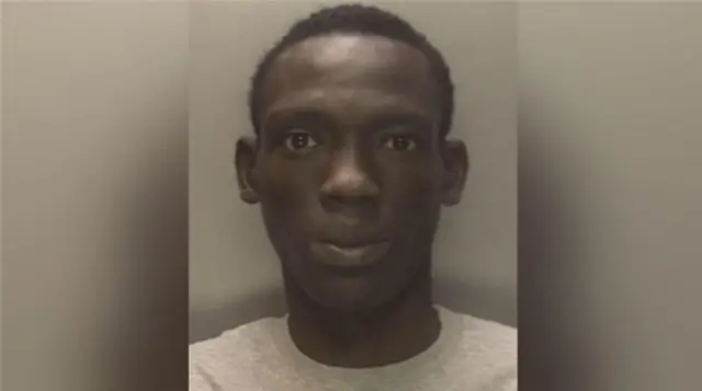 Police mugshot of Deng Majek
