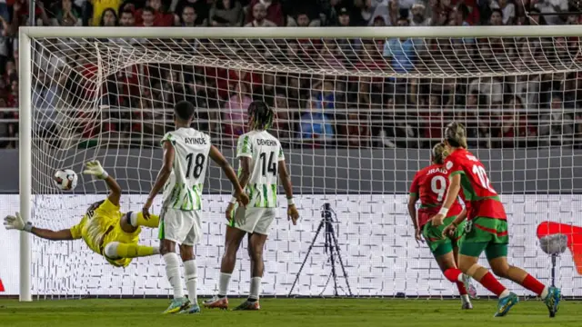 Morocco's Ghizlane Chebbak scores