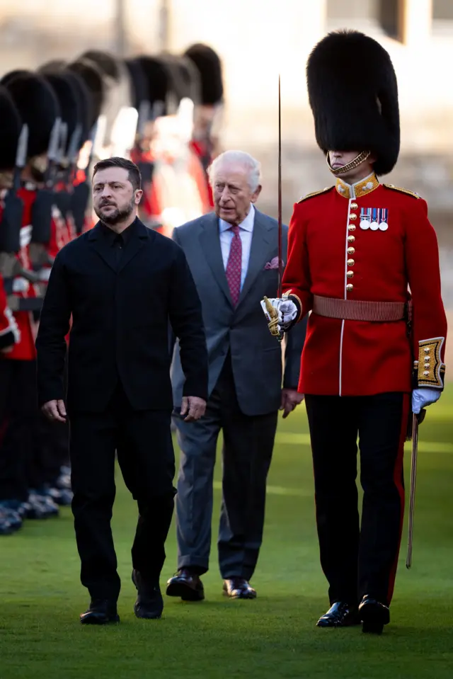 Zelensky and the King next to a guard of honour