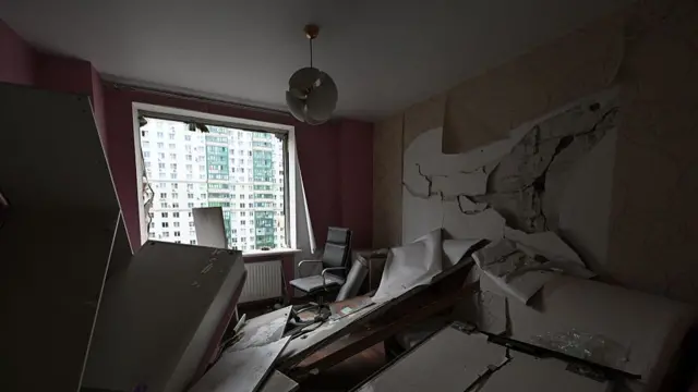 Inside shot of a flat damages in a drone explosion in Krasnogorsk, Moscow Oblast. Parts of an internal wall collapsed on a white couch, the window has been blown in
