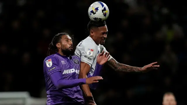 Sheffield United's Jairo Riedewald (left) and Preston North End's Daniel Jebbison (right) battle for the ball