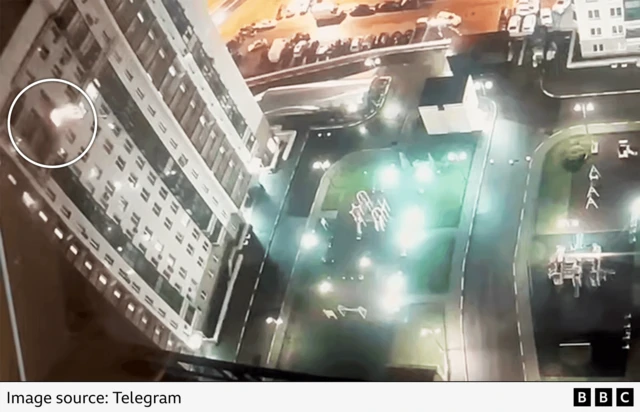 An explosion can be seen coming from the apartment on the 14th floor