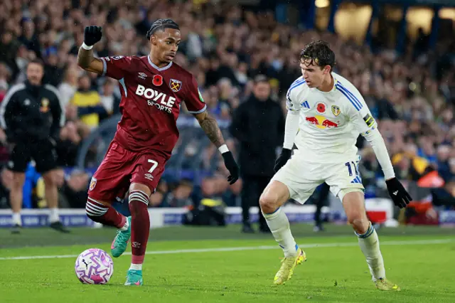 Crysencio Summerville of West Ham United and Brenden Aaronson of Leeds United challenge for the ball