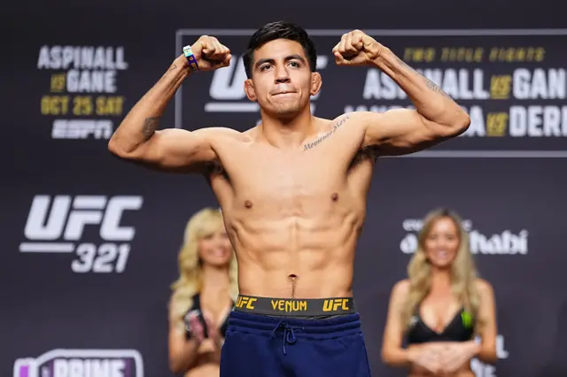 Jose Delgado poses on the scale during the UFC 321 ceremonial weigh-in