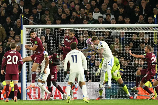 Joe Rodon heads the ball to score