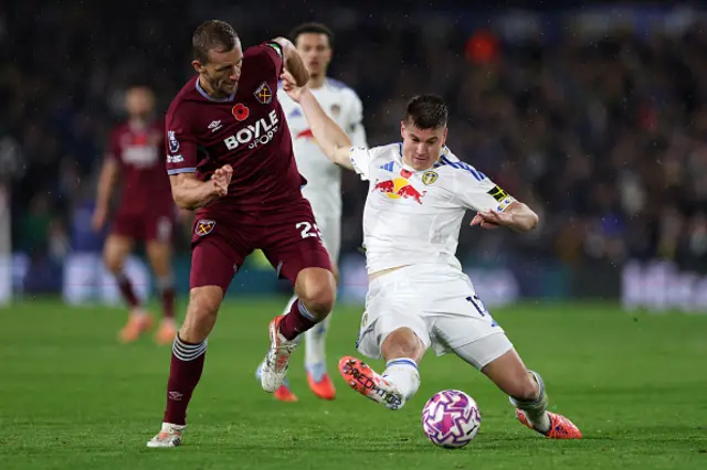 Jaka Bijol of Leeds United battles for possession with Tomas Soucek