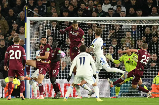 Joe Rodon heads the ball
