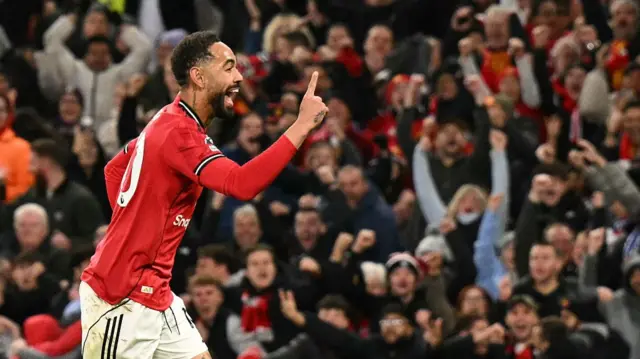 Manchester United's Brazilian striker #10 Matheus Cunha celebrates