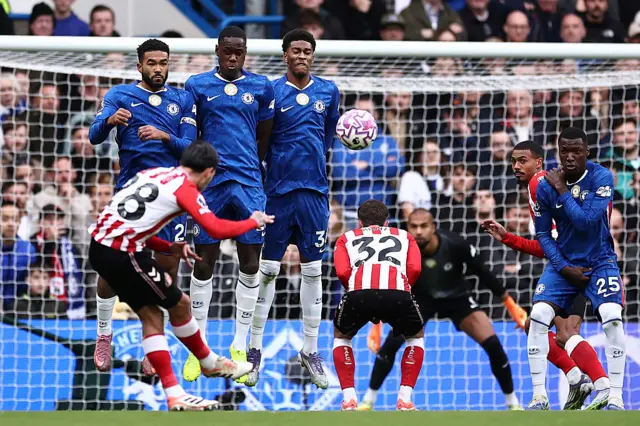 Enzo Le Fee takes a free kick
