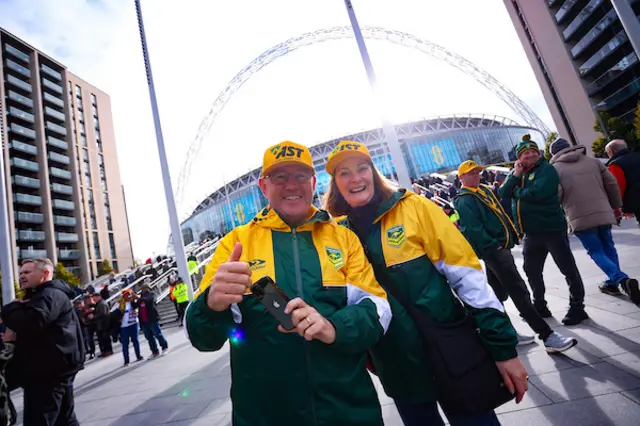 Fans outside Wembley pose
