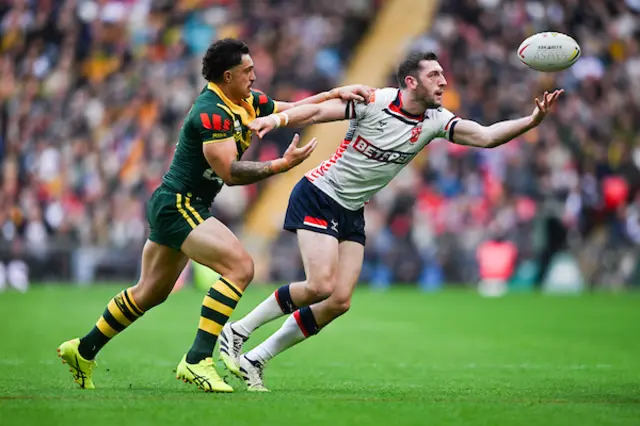 Jake Wardle of England is tackled by Kotoni Staggs of Australia