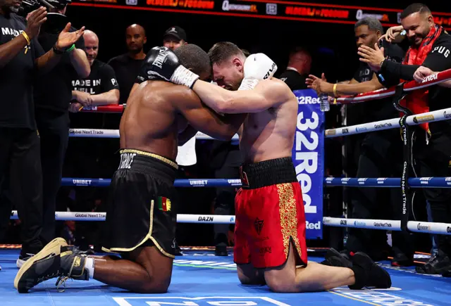 Juergen Uldedaj embraces Rolly Lambert after the IBO World Cruiserweight Title fight