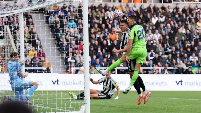 Sasa Lukic of Fulham scores