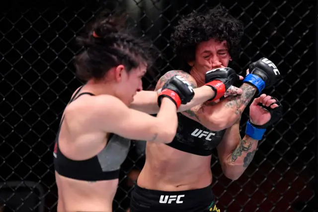 Mackenzie Dern punches Virna Jandiroba of Brazil