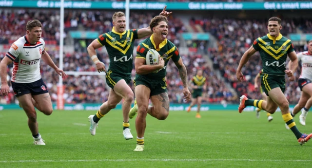 Australia's Reece Walsh scores their first try