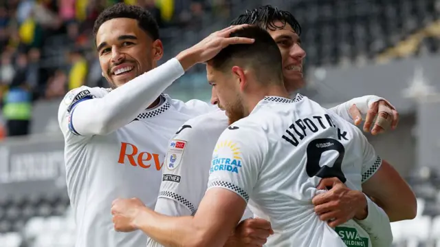 Swansea goalscorer Zan Vipotnik celebrates with team-mates