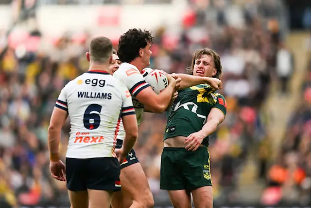 A scuffle between Herbie Farnworth of England and Australia