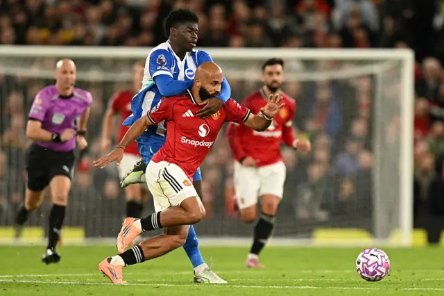 Carlos Baleba fouls Manchester United's Bryan Mbeumo
