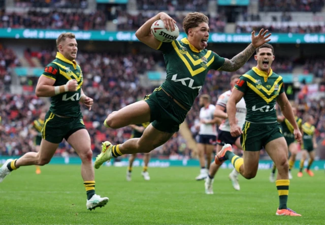 Australia's Reece Walsh scores their first try