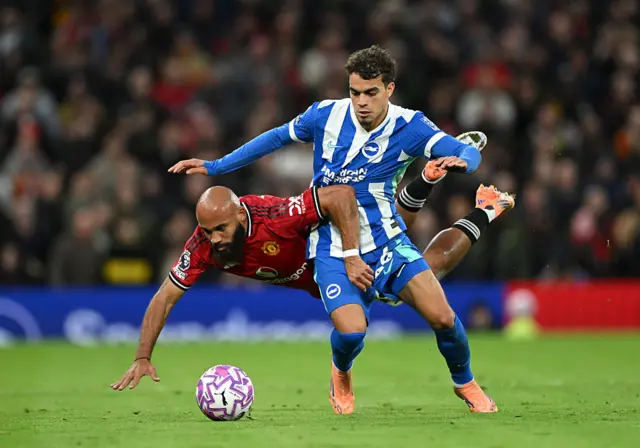 Bryan Mbeumo is tackled by Yasin Ayari