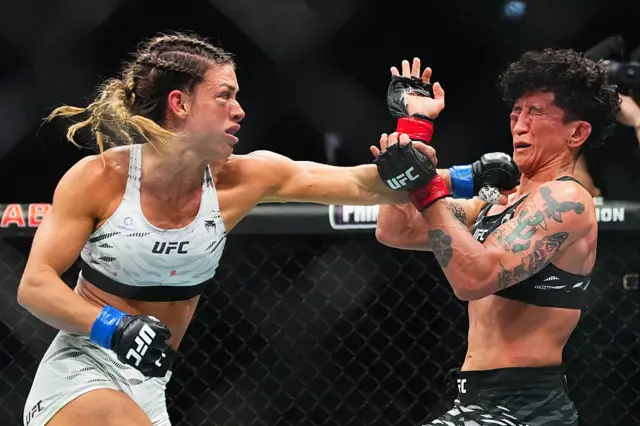 Mackenzie Dern punches Virna Jandiroba of Brazil