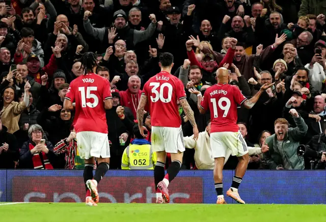 Manchester United celebrate third goal.