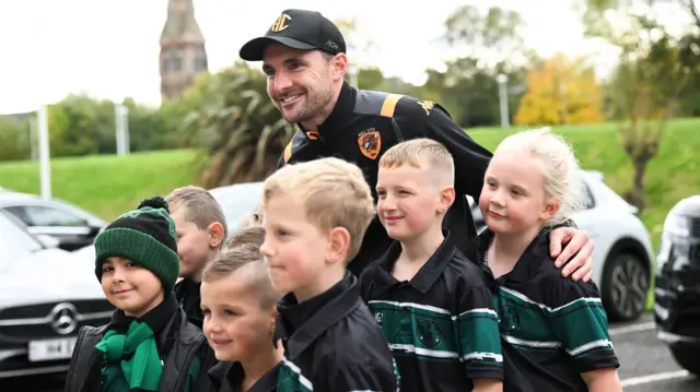Hull's Lewis Coyle poses with young fans