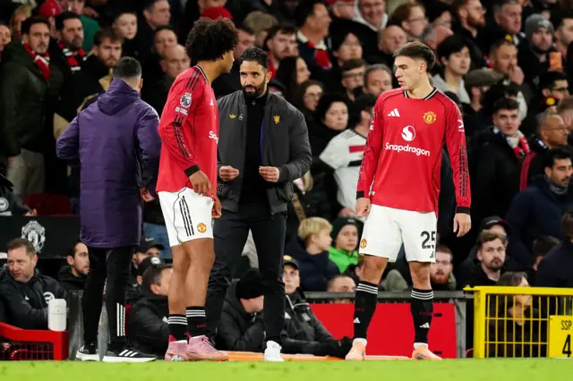 Manchester United manager Ruben Amorim (centre) speaks to Joshua Zirkzee (left) and Manuel Ugarte on the touchline