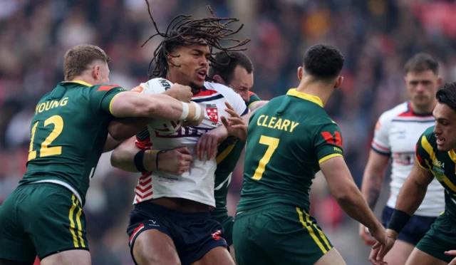 England's Dom Young in action with Australia's Hudson Young