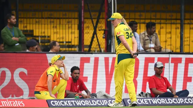 Alyssa Healy of Australia speaks to team mate Kim Garth