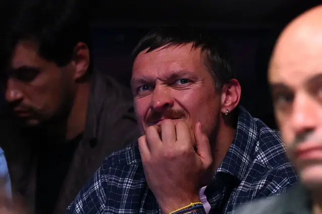 Oleksandr Usyk with his hand on his chin