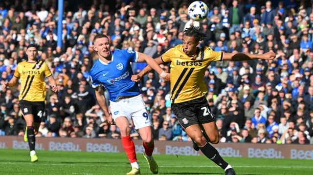 Portsmouth striker Colby Bishop battles with Stoke defender Ashley Phillips