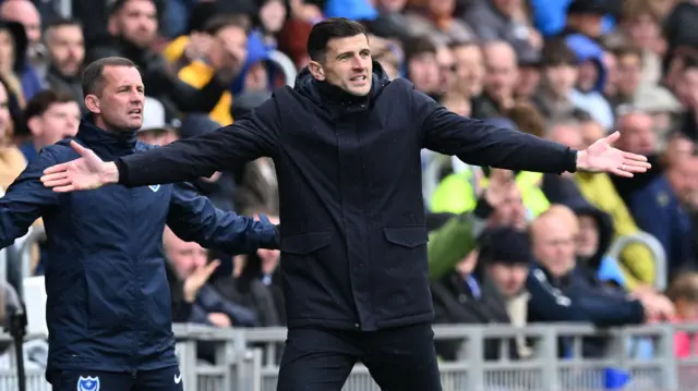 Portsmouth boss John Mousinho gestures on the sideline