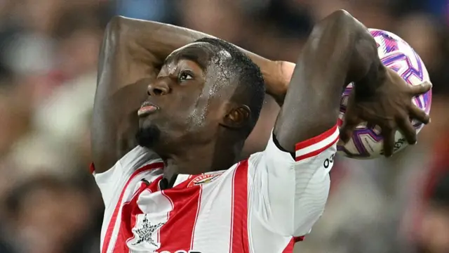 Michael Kayode takes a long throw-in