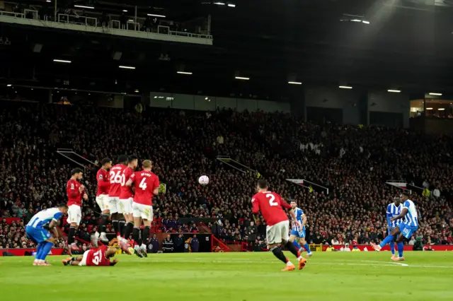 Brighton and Hove Albion's Danny Welbeck scores their side's first goal from a free-kick during the Premier League match at Old Trafford,
