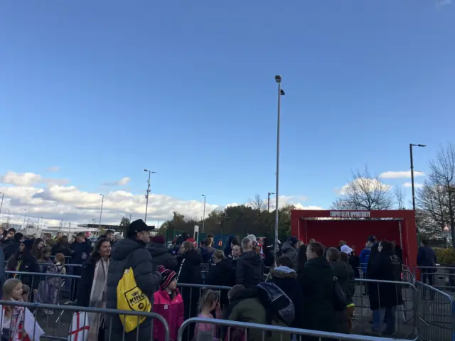 Queues form to get photos with the Euros trophy