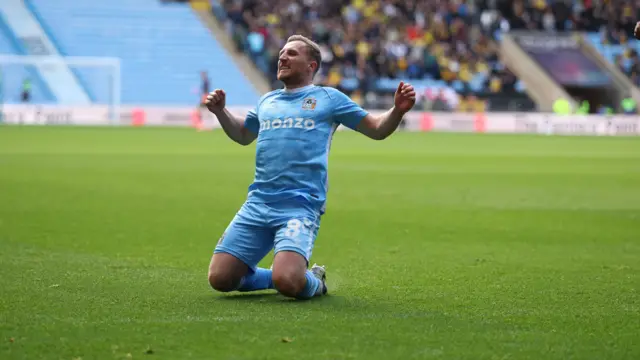 Jamie Allen slides on his knees in celebration