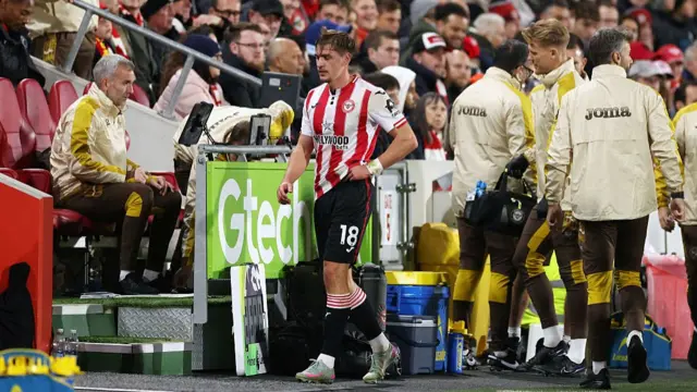 An injured Yehor Yarmolyuk of Brentford