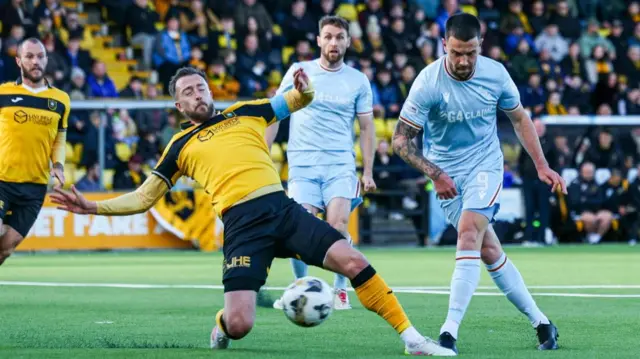 Livingston defender Danny Wilson blocks an effort from Motherwell's Apostolos Stamatelopoulos