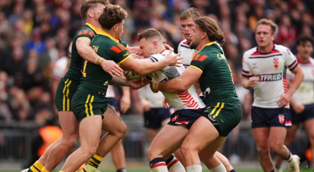 England's Jake Wardle battles against the Australia defence